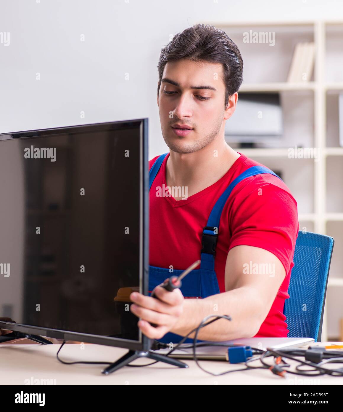 Professional repair engineer repairing broken tv Stock Photo Alamy