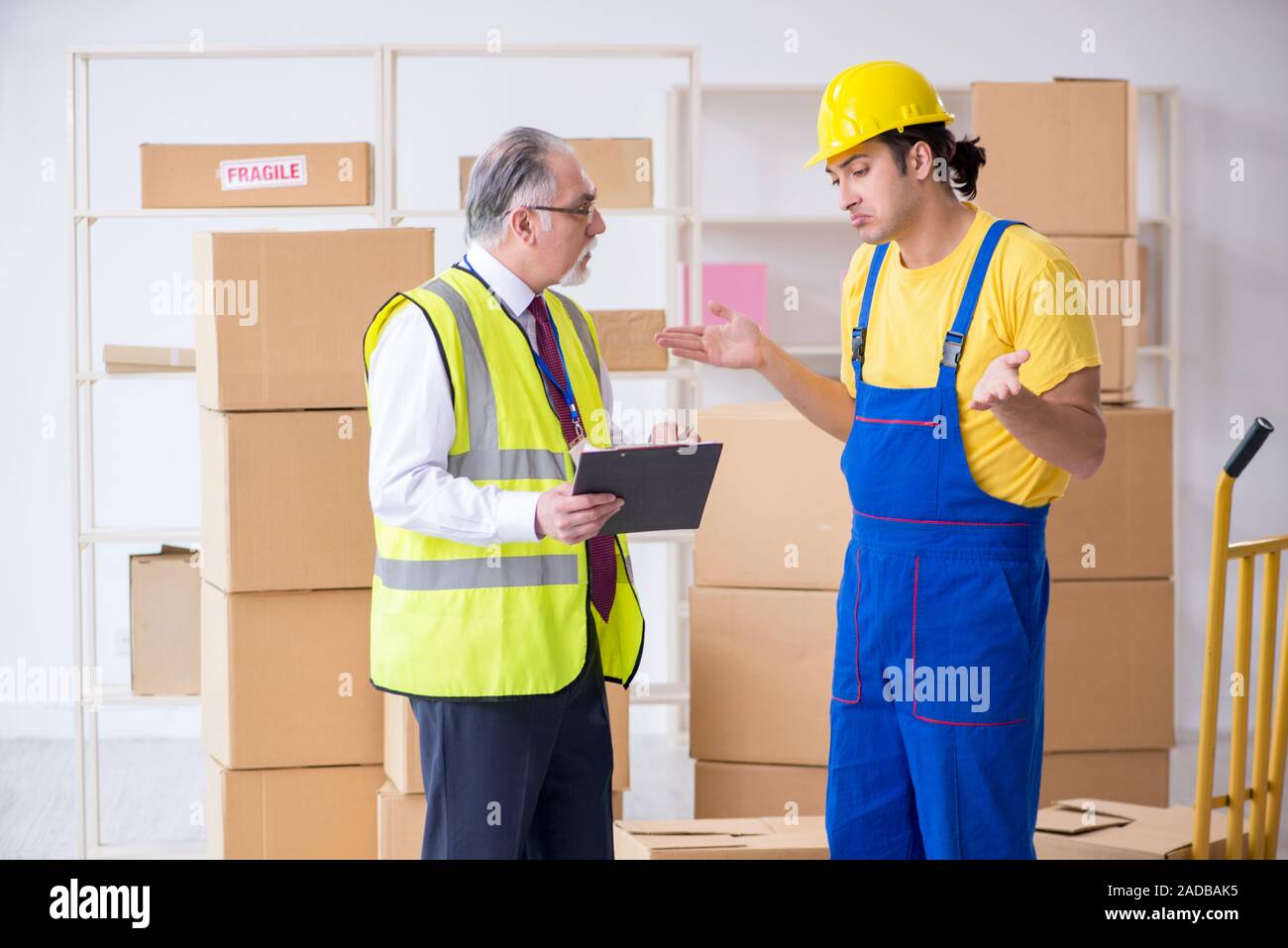 Professional movers doing home relocation Stock Photo