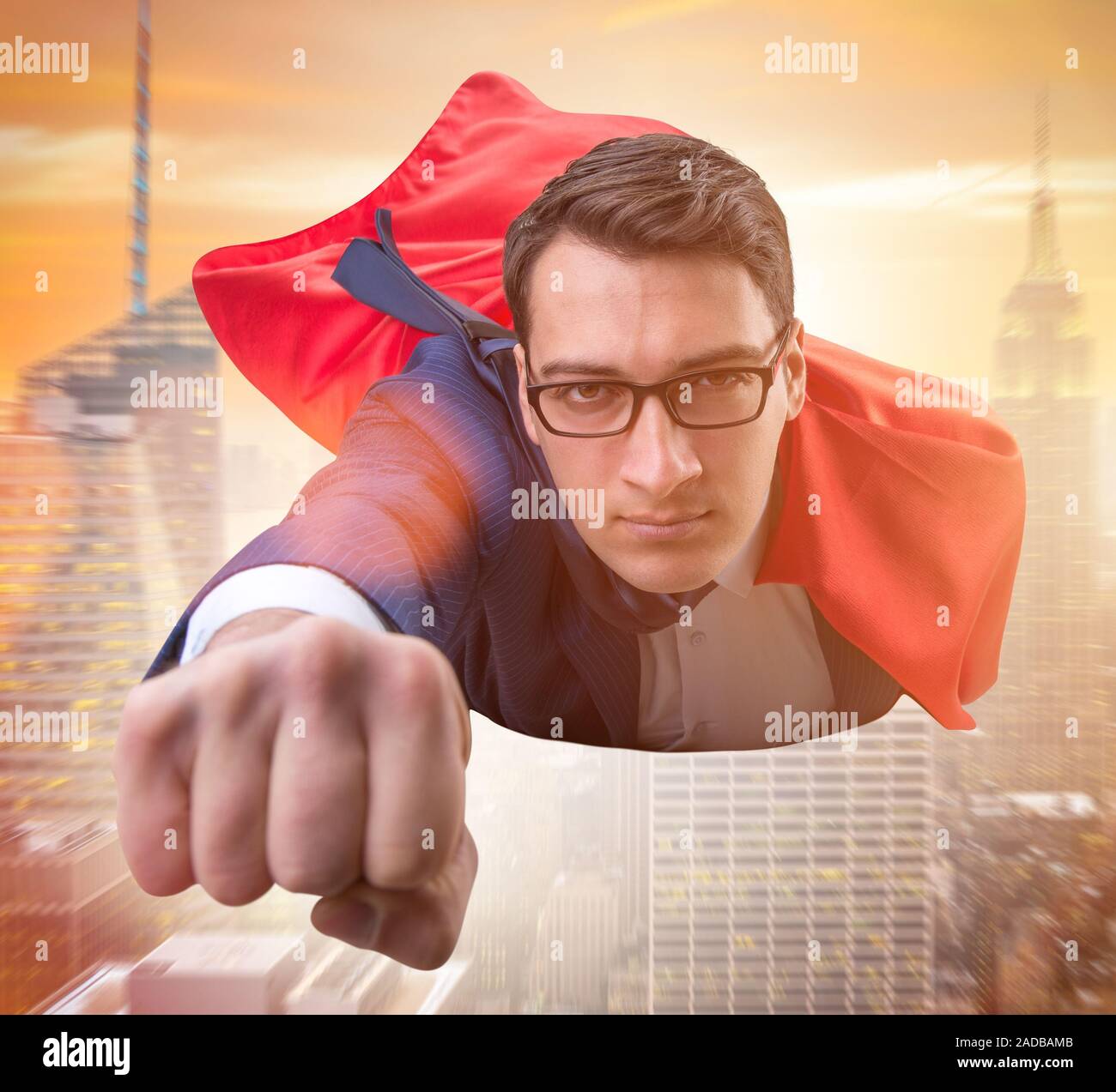 Flying super hero over the city Stock Photo