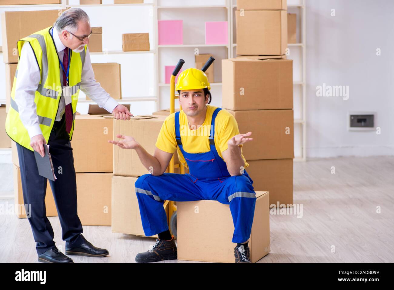 Professional movers doing home relocation Stock Photo