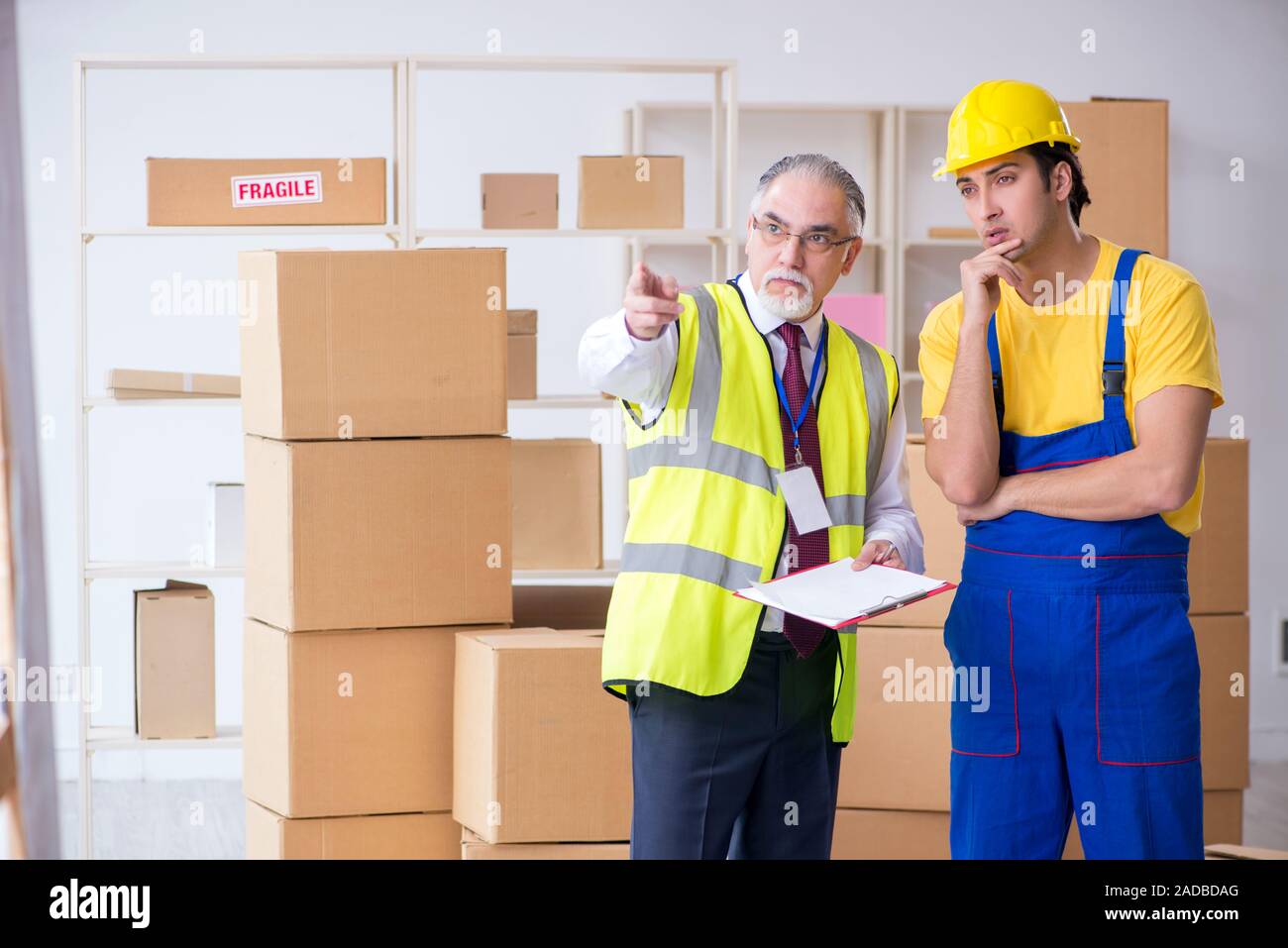 Professional movers doing home relocation Stock Photo