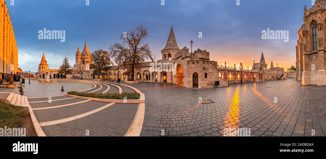 Budapest, Hungary - Panoramic view of the famous Fisherman's Bastion (Halaszbastya) and Matthias Church with a beautiful autumn sunrise and clear blue Stock Photo