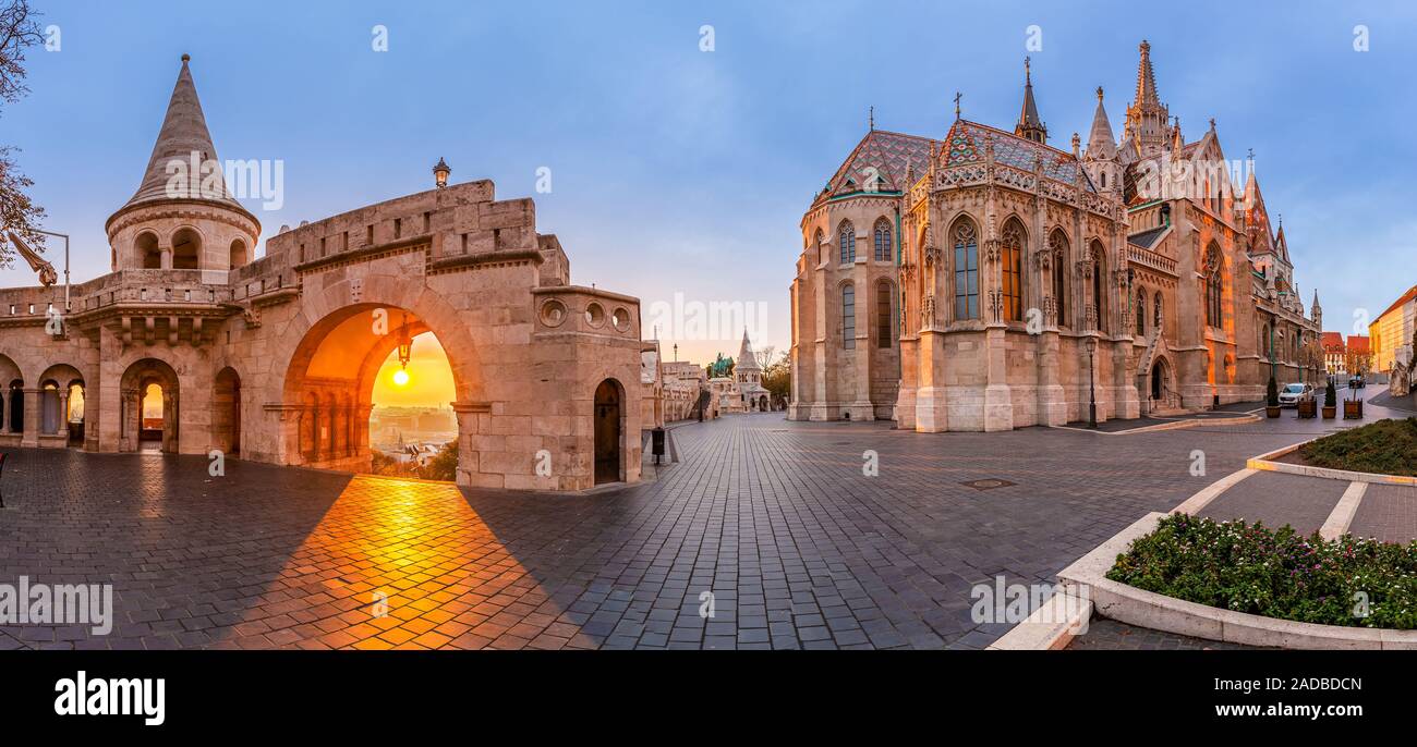 Budapest, Hungary - Panoramic view of the North gate of the Fisherman's Bastion (Halaszbastya) and Matthias Church with a beautiful autumn sunrise and Stock Photo