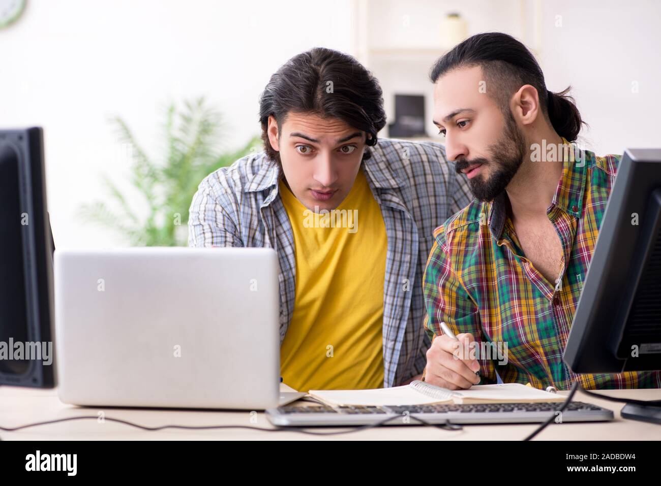 Two it specialists working in the office Stock Photo