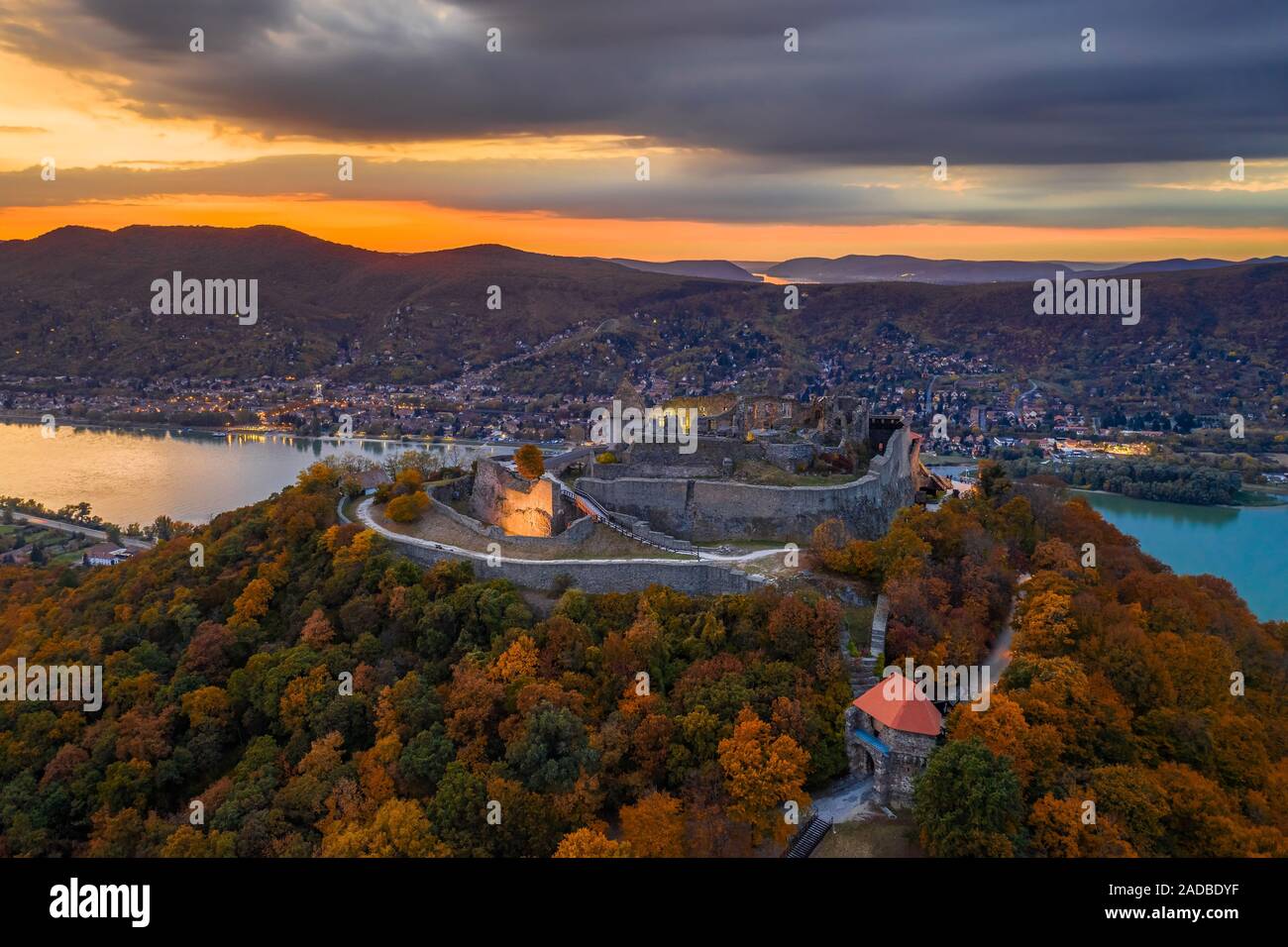 Visegrad, Hungary - Autumn at Visegrad. Aerial drone view of the beautiful high castle of Visegrad with colorful sunset and Dunakanyar at background Stock Photo