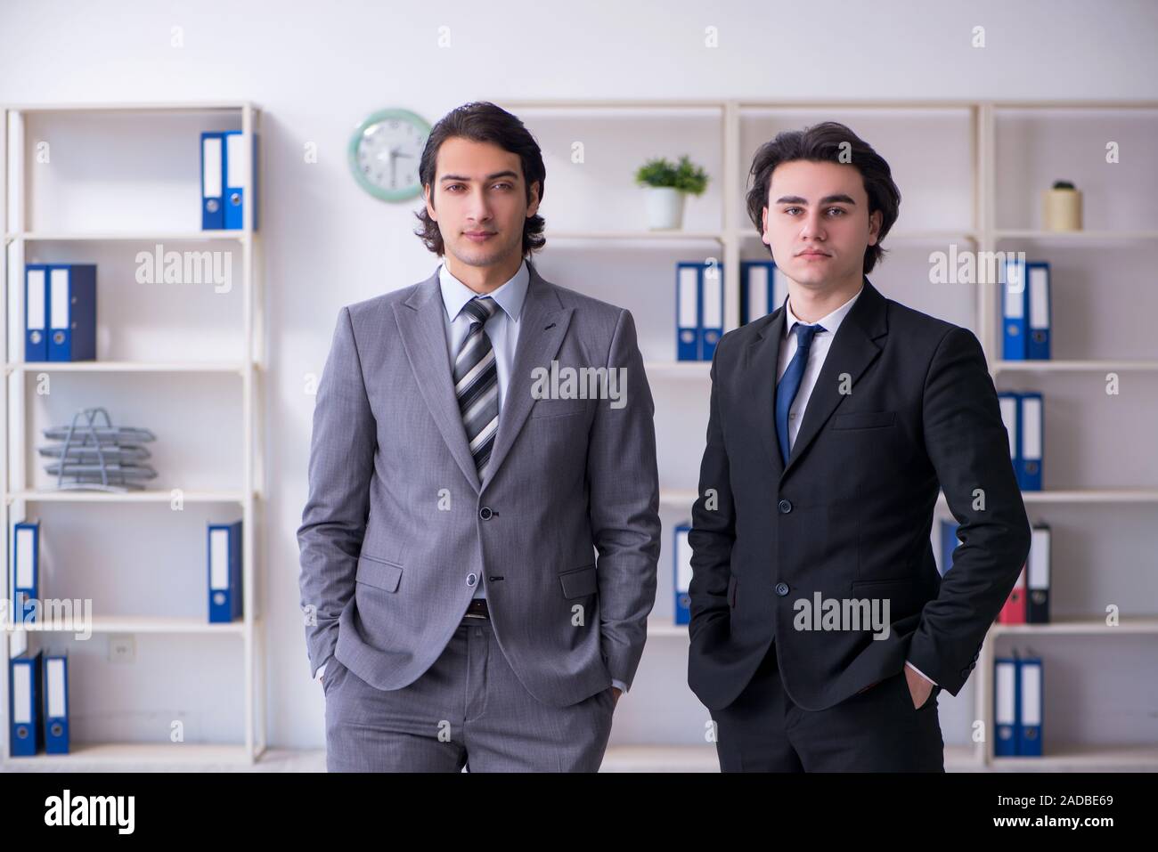 Two young businessmen meeting in the office Stock Photo - Alamy