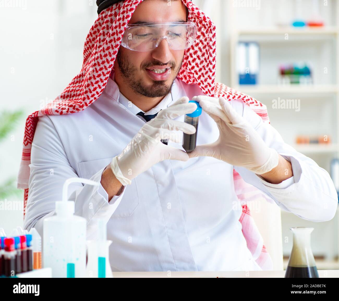 Arab chemist scientist testing quality of oil petrol Stock Photo