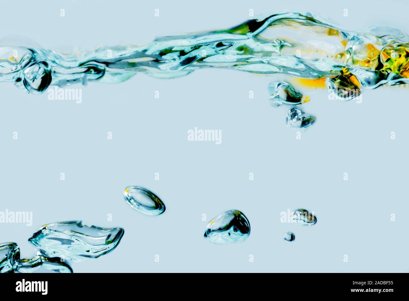 Side view of a rippled water surface mixed with vegetable oil and ...