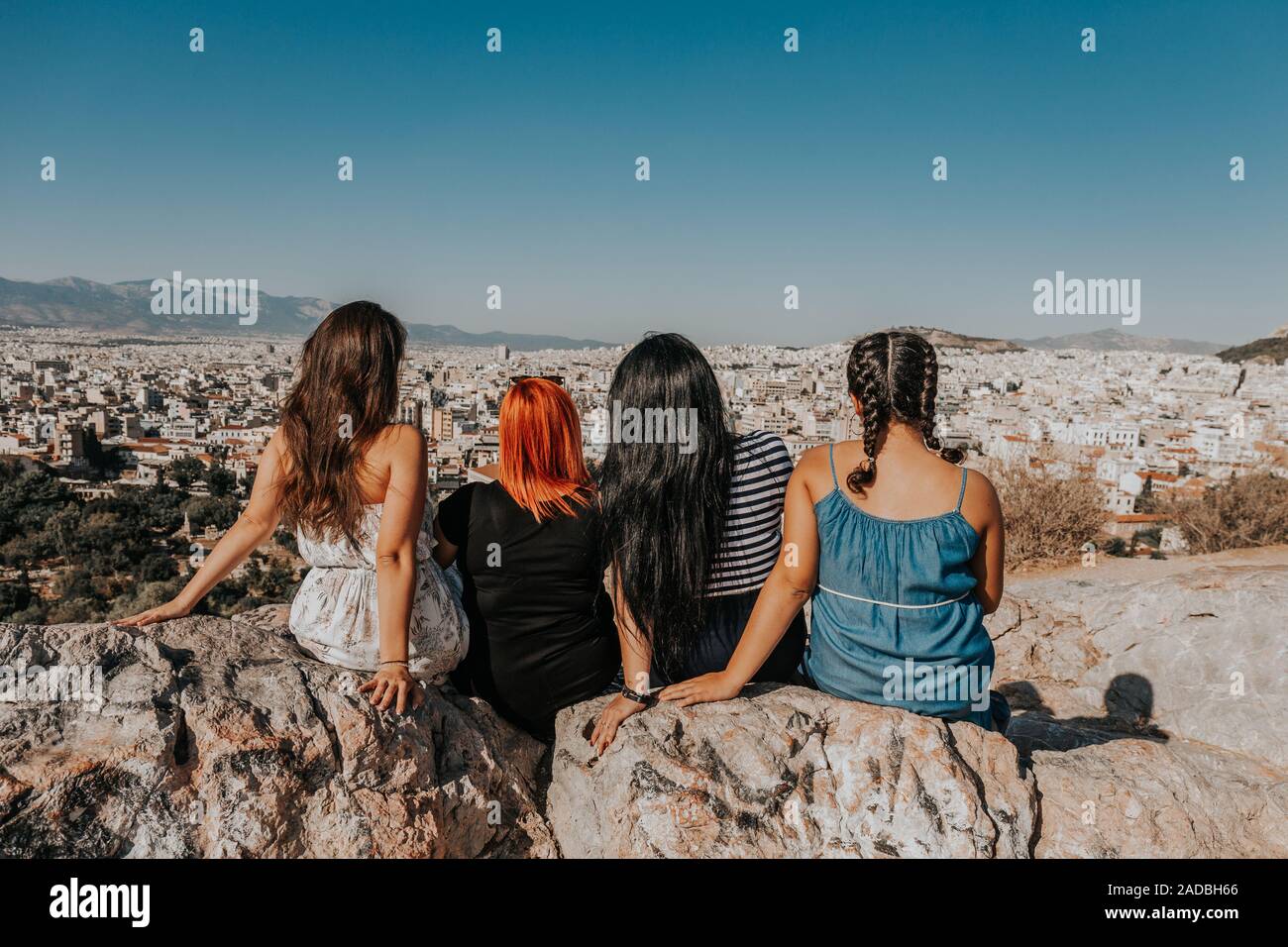 women enjoying the fantastic view from the outlook mountain Areopagus overseeing Athens city Stock Photo