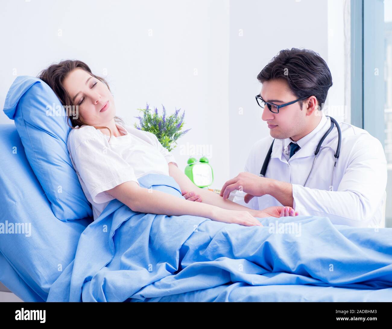 Doctor doing medical injection in hospital room Stock Photo Alamy