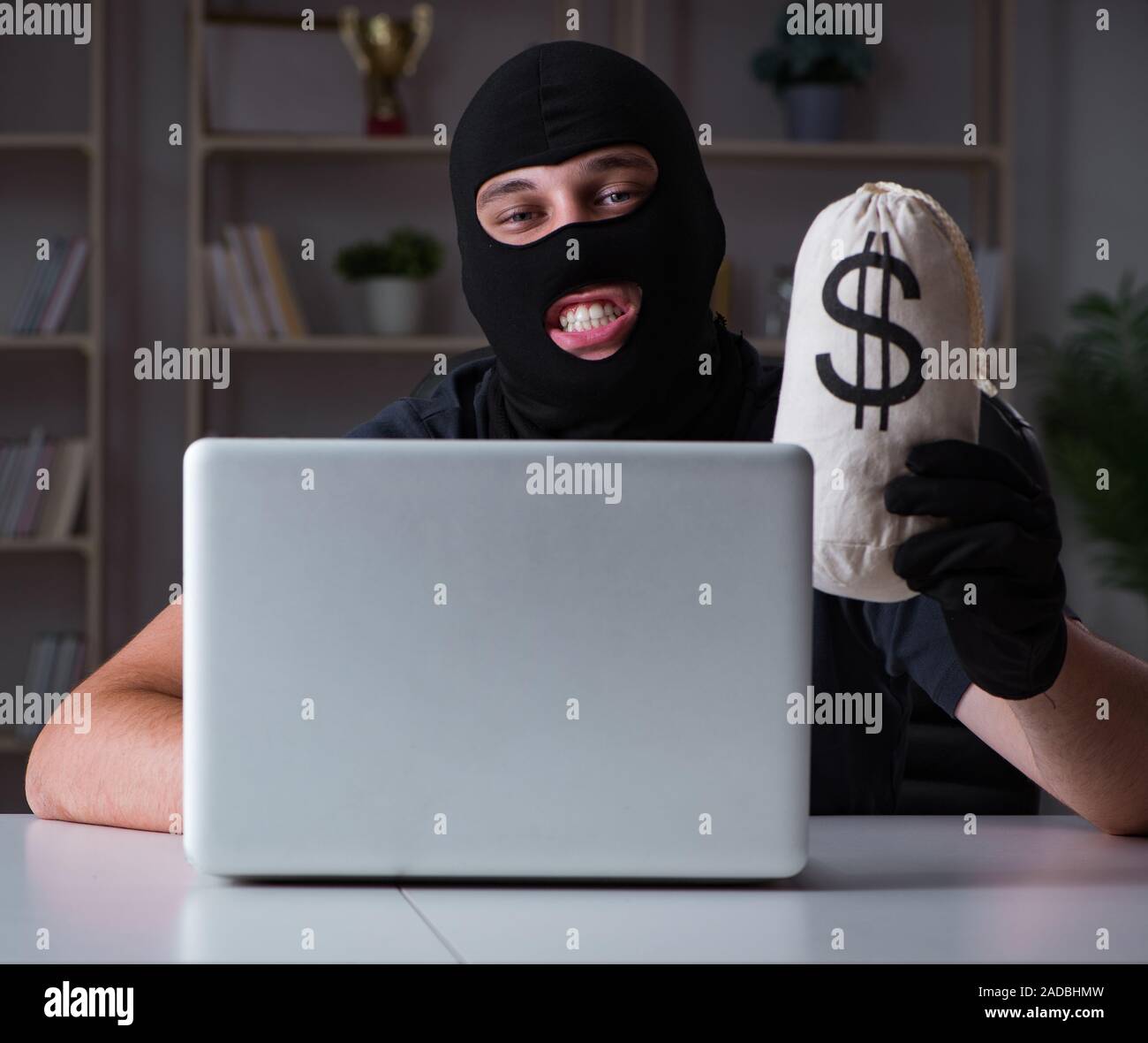 Hacker hacking computer late at night Stock Photo - Alamy