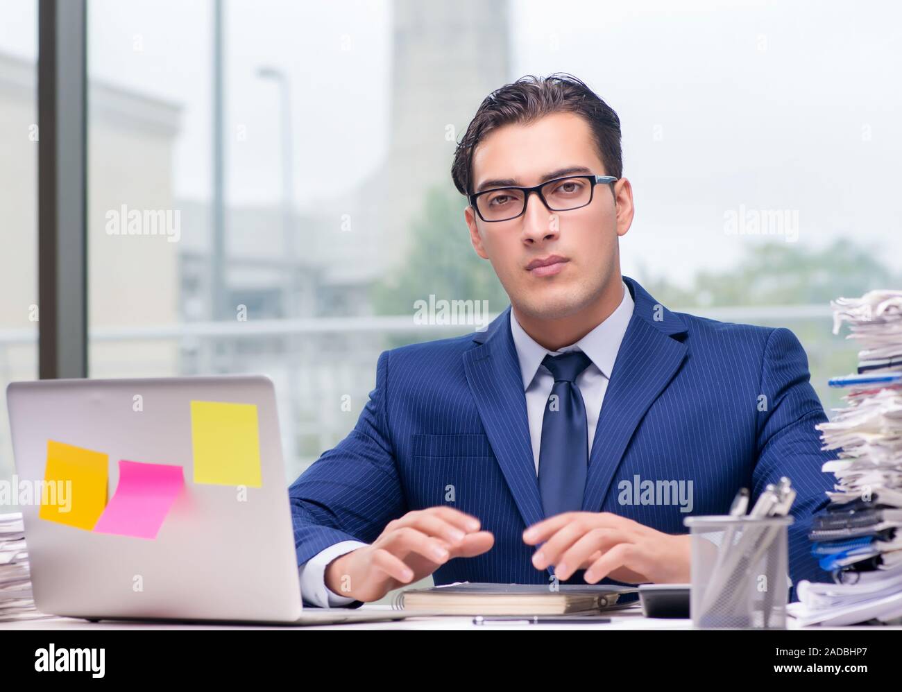 workaholic-businessman-overworked-with-too-much-work-in-office-stock