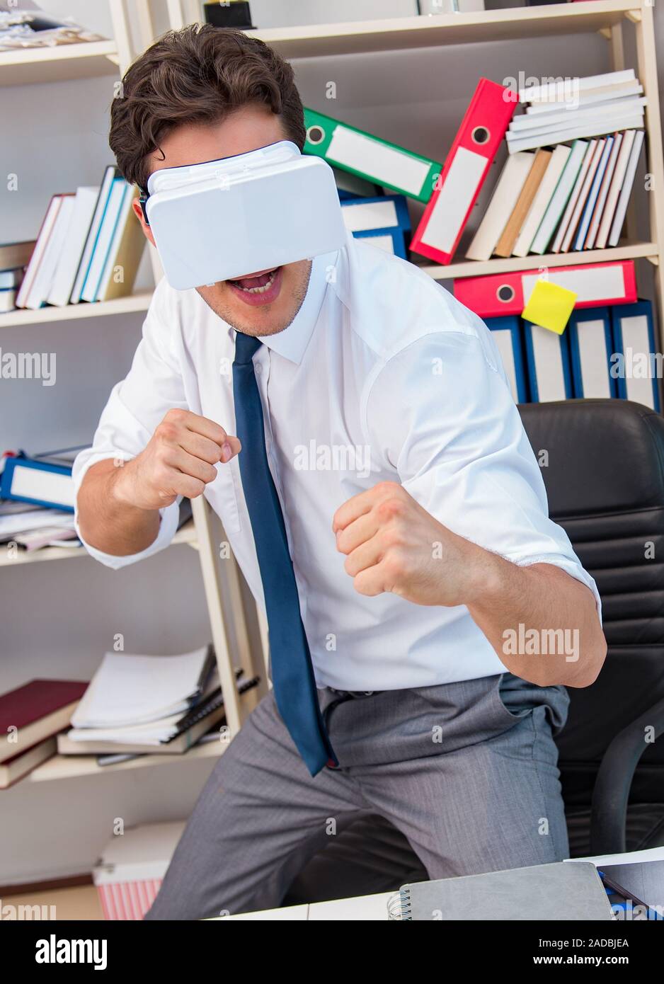 Employee watching movie on vr virtual reality glasses Stock Photo - Alamy