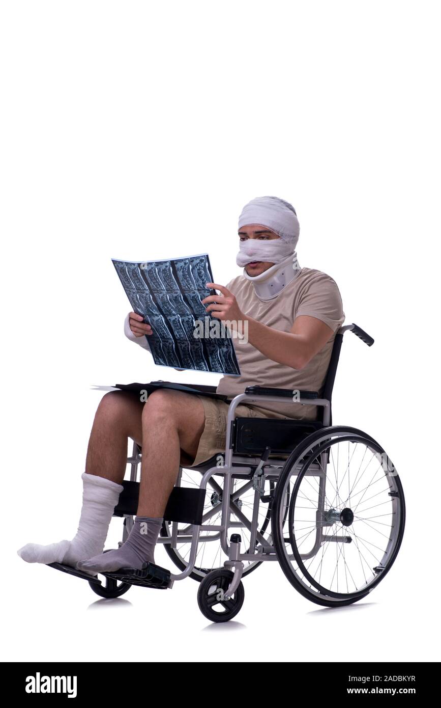 Injured man in wheel-chair isolated on white Stock Photo