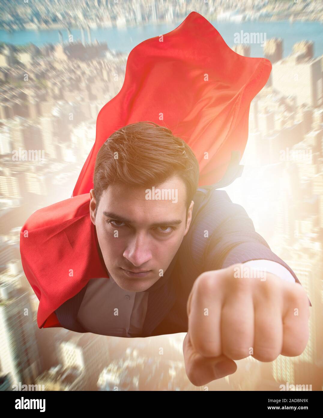The flying super hero over the city Stock Photo