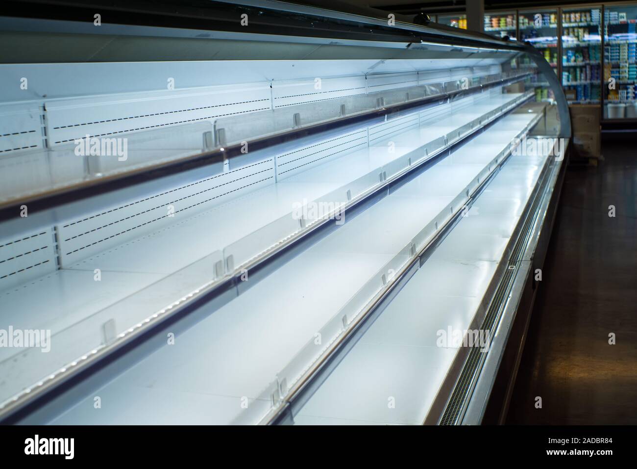 Empty shelves in store. Supermarket with empty shelves for goods Stock