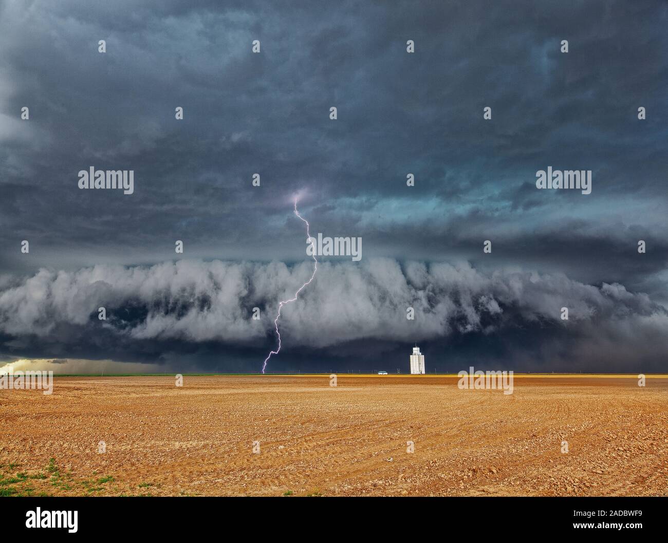 Lightning strike over wheat field. Time-exposure image of a lightning ...