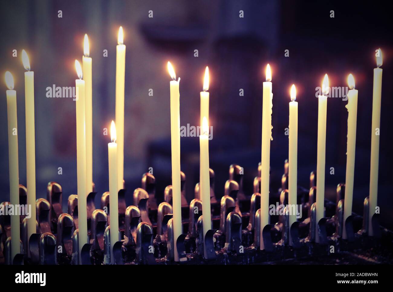 many candles lit by the faithful inside a church Stock Photo Alamy