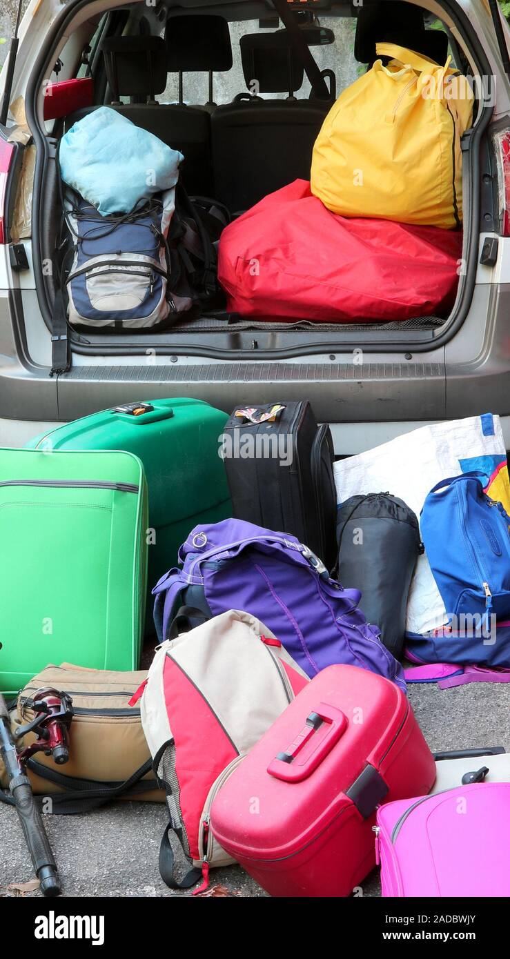 lots of luggage ready to be loaded on a car for the holidays Stock Photo -  Alamy
