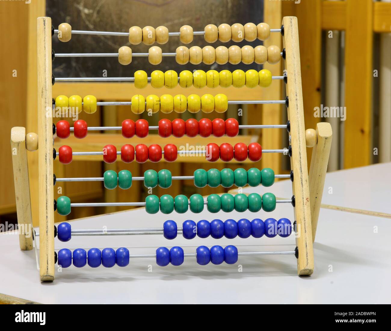 Wooden Abacus with many small beads in the classroom Stock Photo Alamy