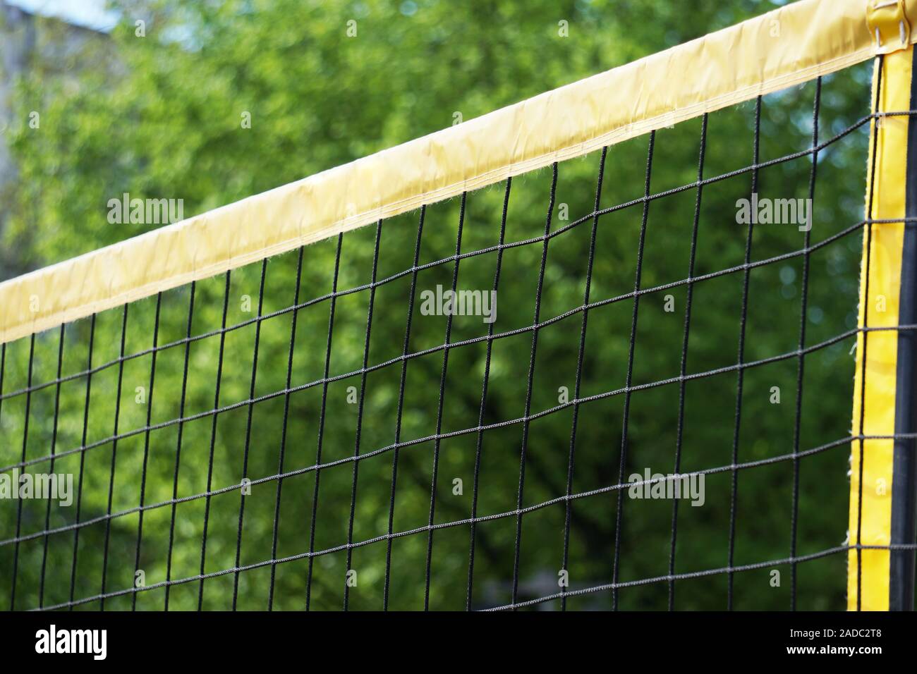 beach volleball net against trees - sports background with copy space Stock Photo