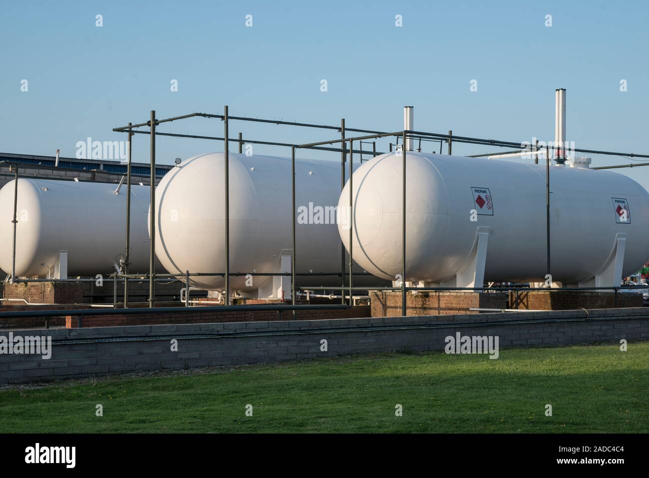 Propane tanks with hazard symbols Stock Photo Alamy