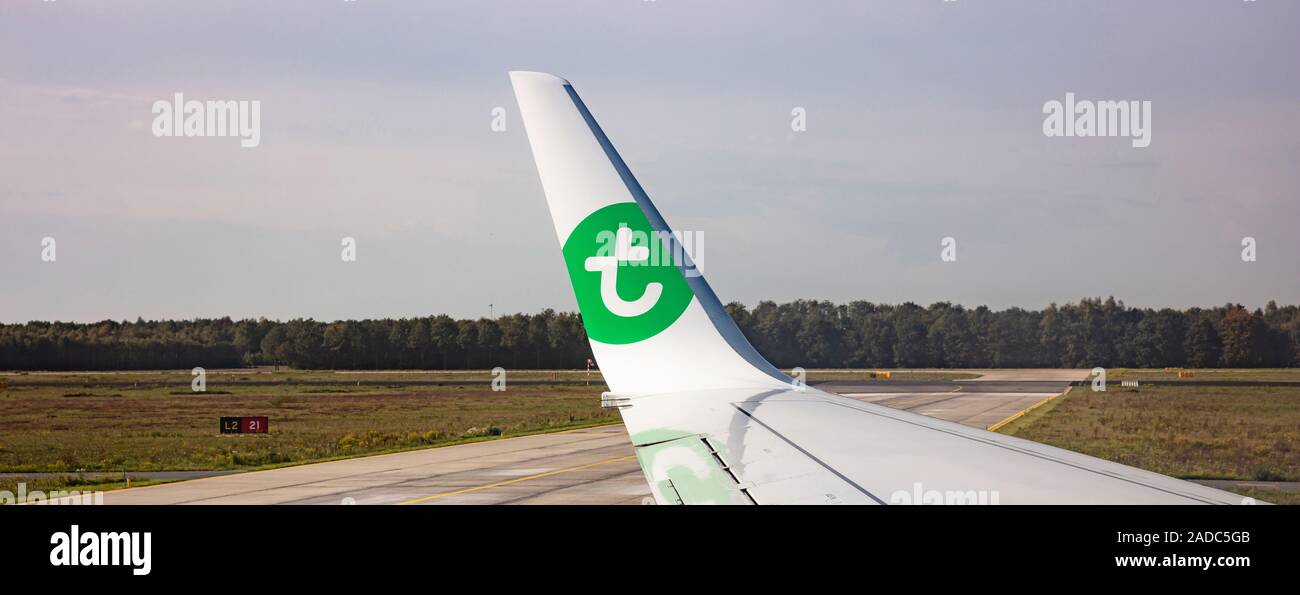 Eindhoven Netherlands. October 14, 2019. Transavia logo on a plane wing at Eindhoven airport. View out of airplane window. Stock Photo