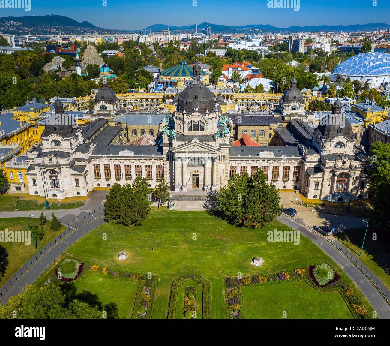 Budapest, Hungary - Aerial drone view of the famous Szechenyi Thermal Bath in City Park (Varosliget) on a sunny summer day with clear blue sky and gre Stock Photo