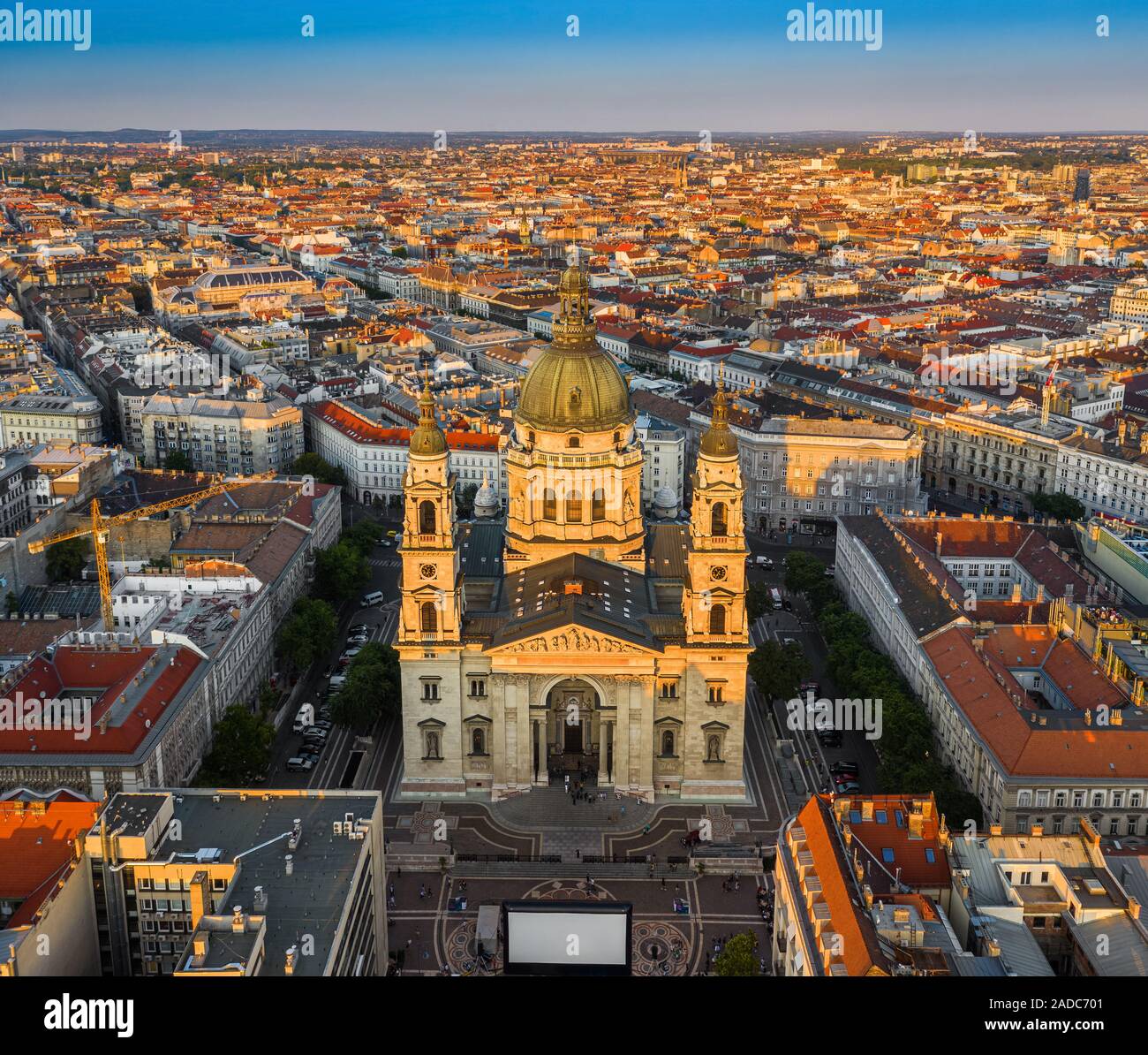 Budapest, Hungary - Aerial drone view of the beautiful St. Stephen's Basilica from high above at sunset with warm summer afternoon lights and clear bl Stock Photo