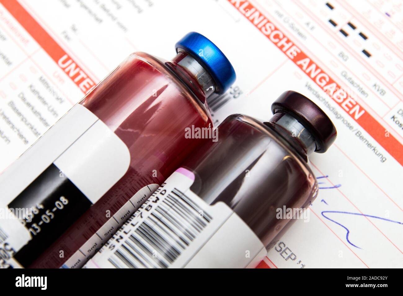 Blood culture bottles. Two standard blood culture bottles, with