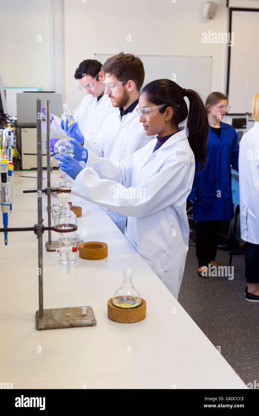 Chemistry students using separating funnels for solvent-based ...