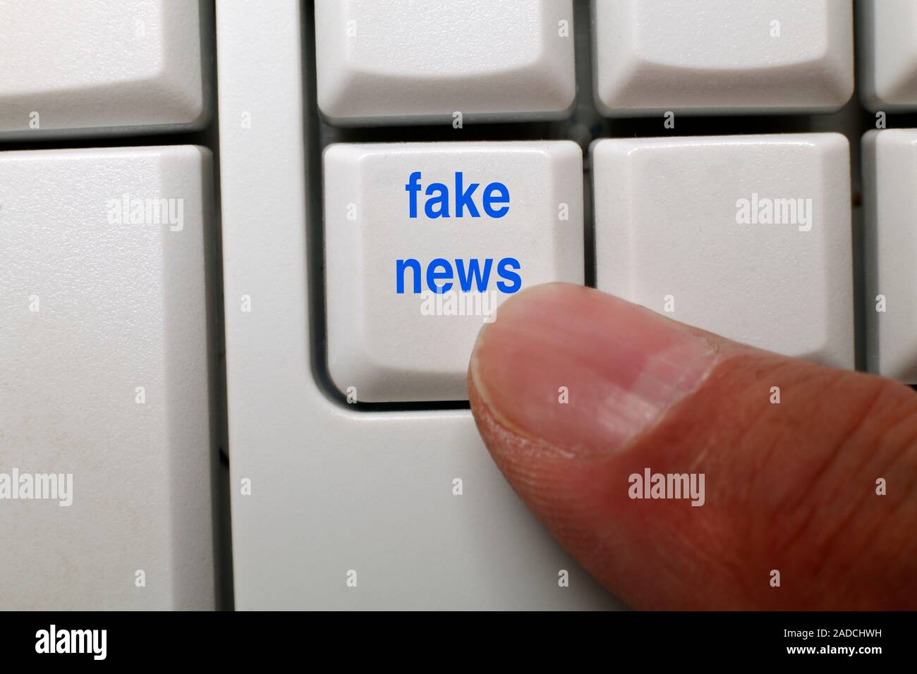 Fake news key on a computer keyboard. Stock Photo