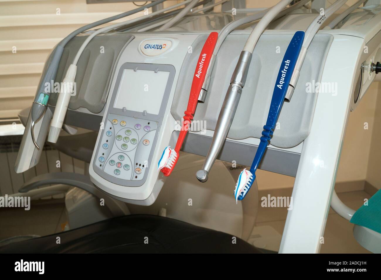 Dental chair control panel with tools and toothbrushes Stock Photo - Alamy