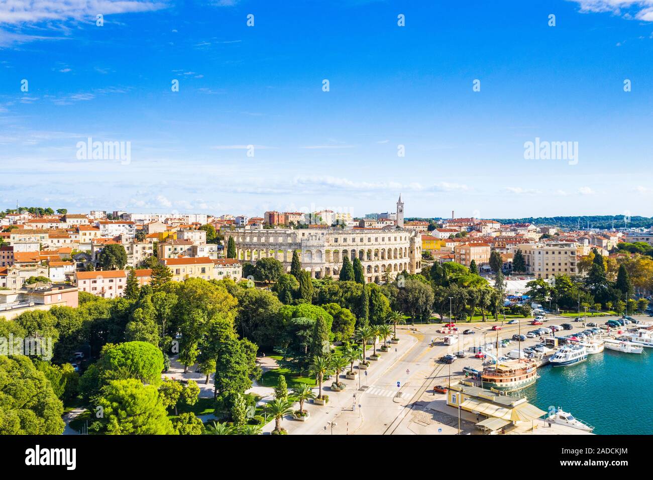 Croatia, Istria, city of Pula, panoramic view of ancient Roman arena, historic amphitheater and old town center from drone Stock Photo