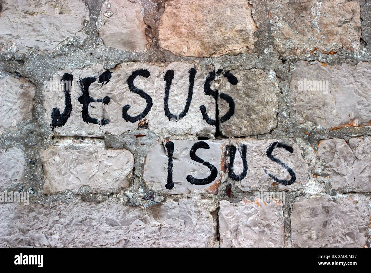Jesus Isus - writing on a stonewall in Dubrovnik, Croatia Stock Photo