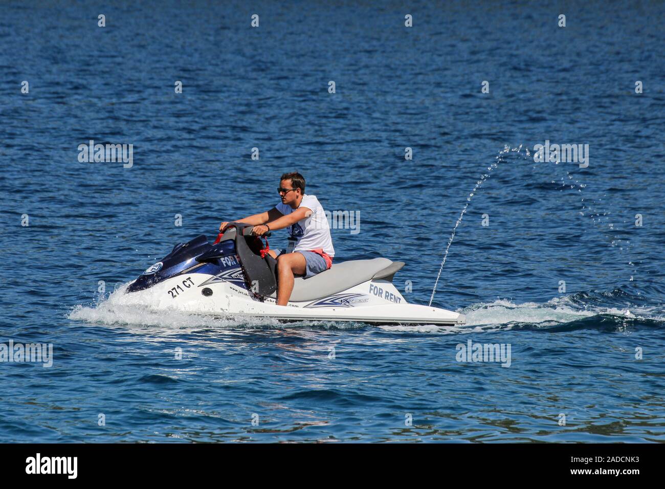 Man with a jet ski or water scooter or personal watercraft Stock Photo