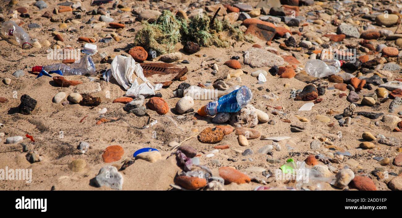 Several items of plastic bottles etc. discarded or washed up on the beach at Hartlepool,England,UK, more evidence of plastic pollution. Stock Photo