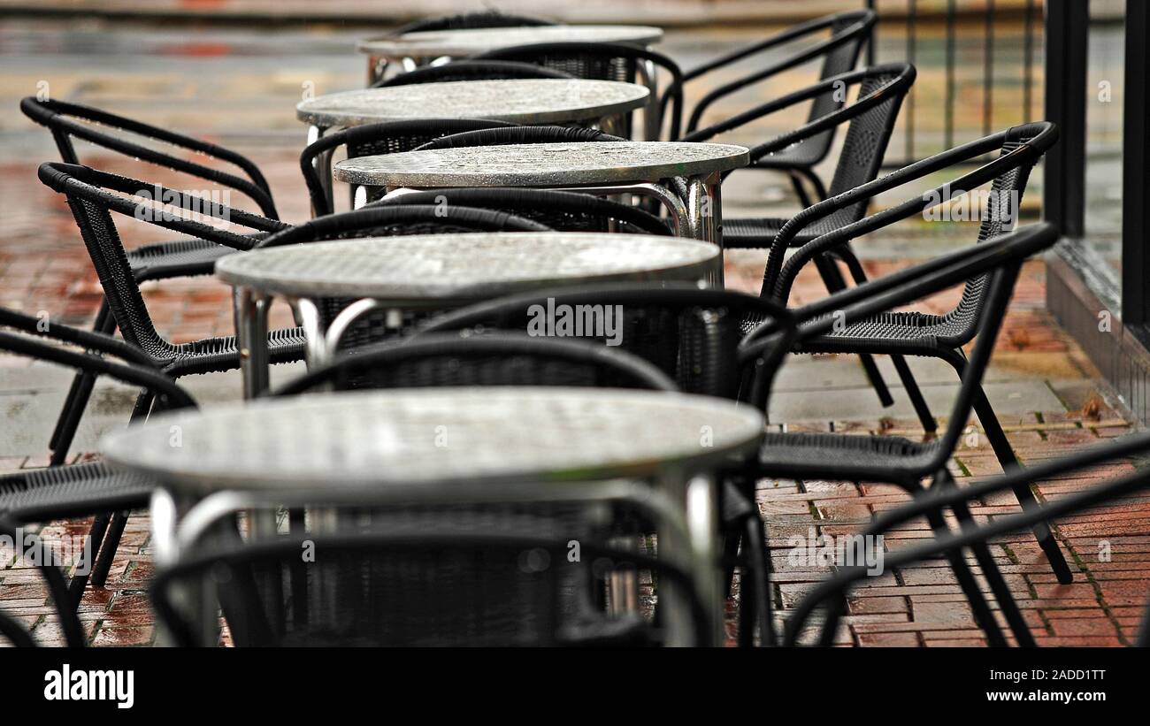 Metal tables and chairs outside restaurant on a rainy day in Fleetwood
