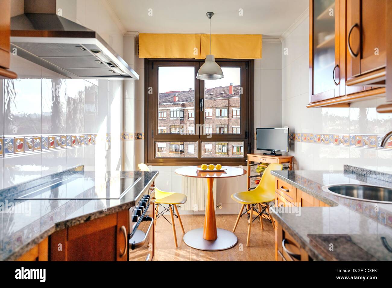 Kitchen on two fronts with dining area Stock Photo