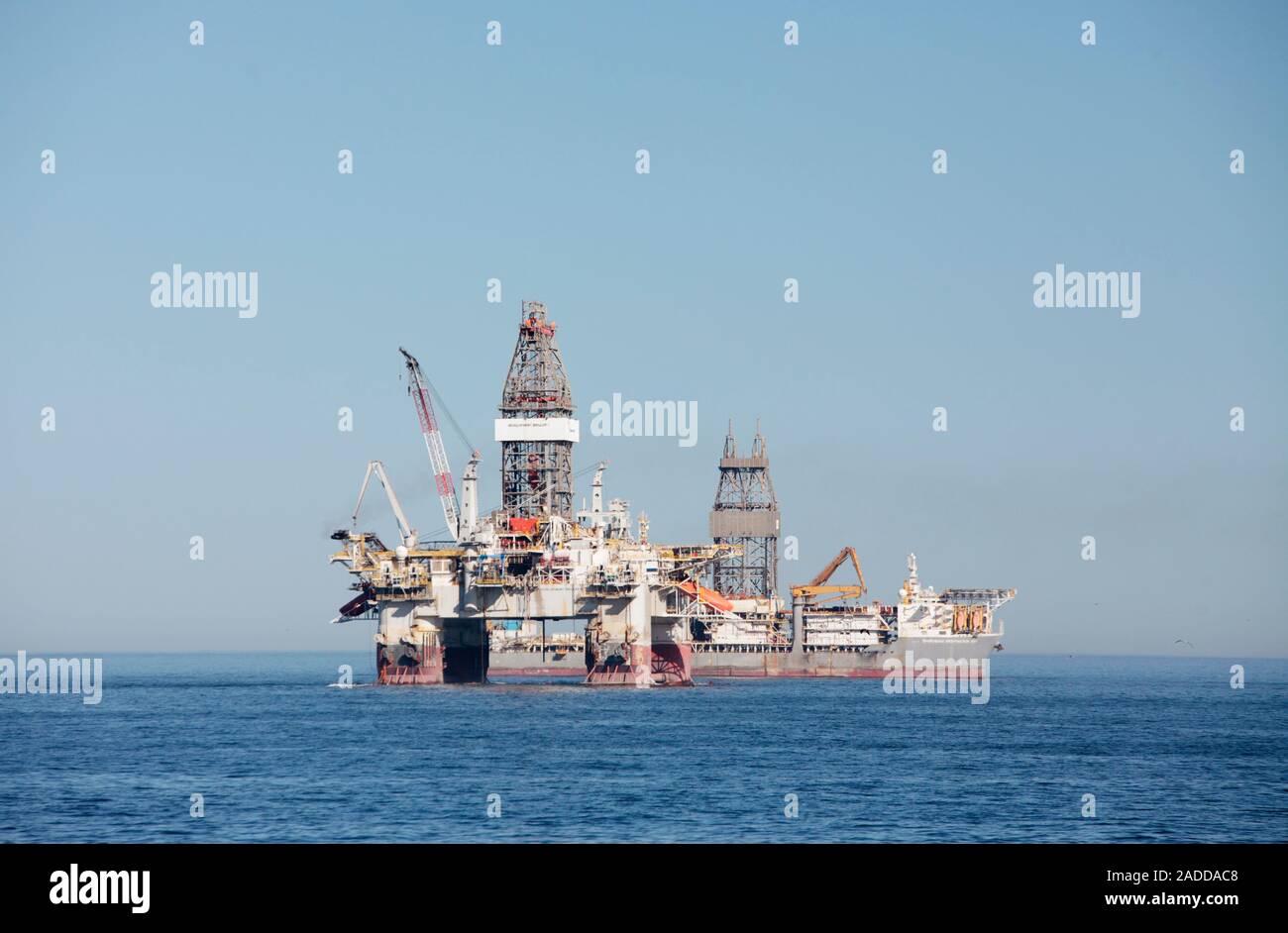Oil rig and drillship at sea. View of the Transocean 'Development