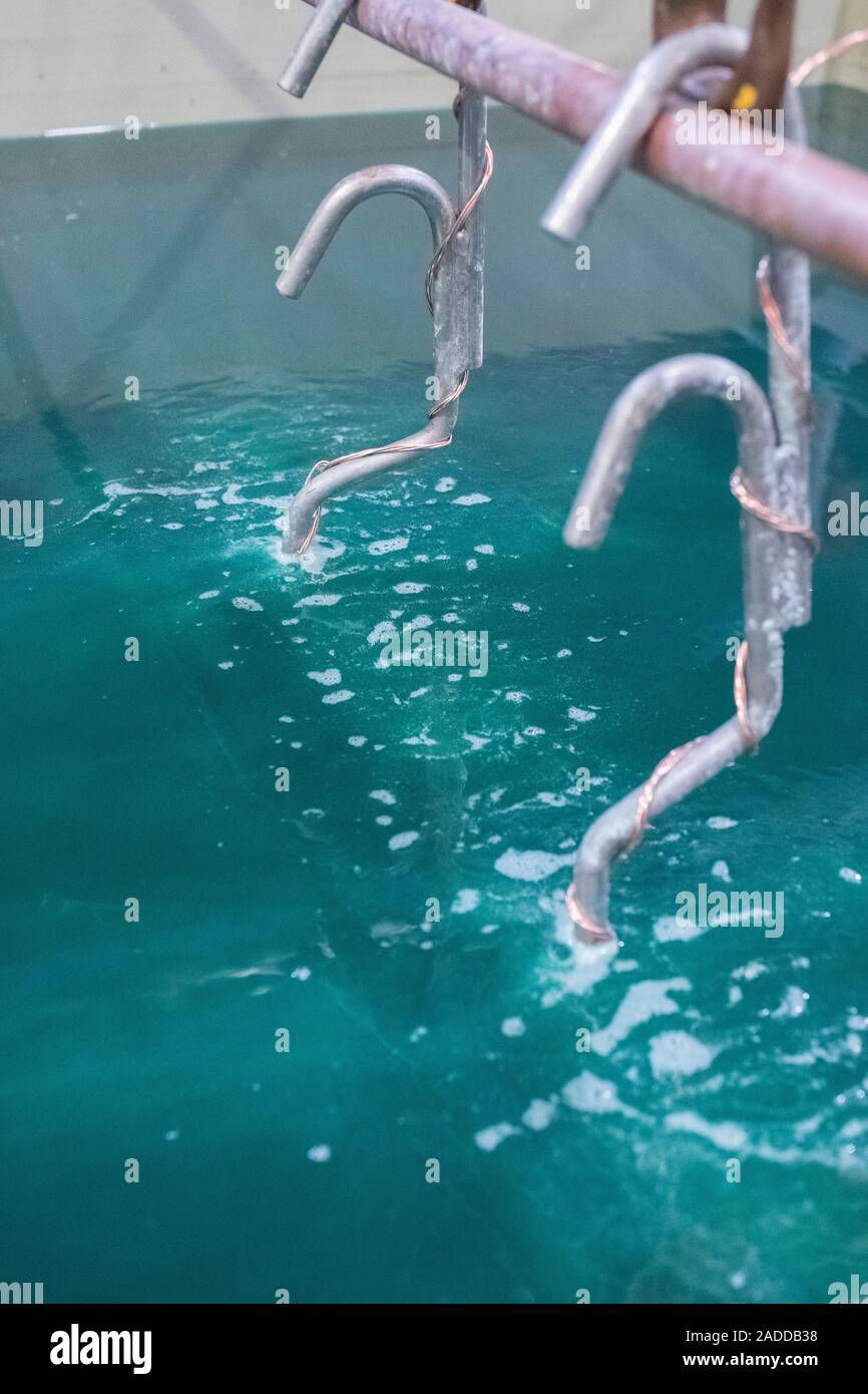 Electroless nickel plating factory. Products in a plating tank at a