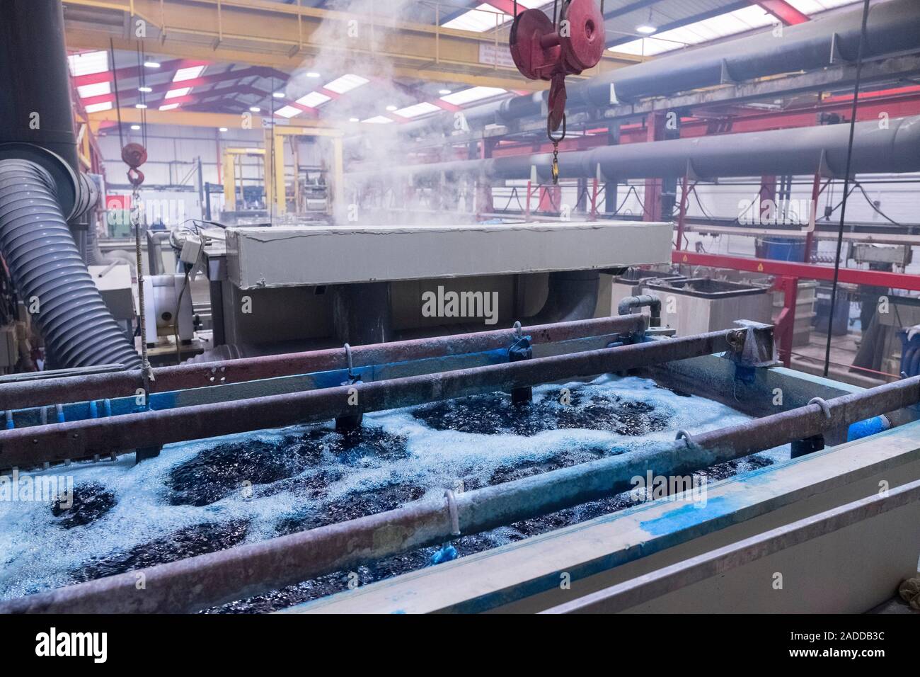 Electroless nickel plating factory. Chemical tanks and rinse tanks at a