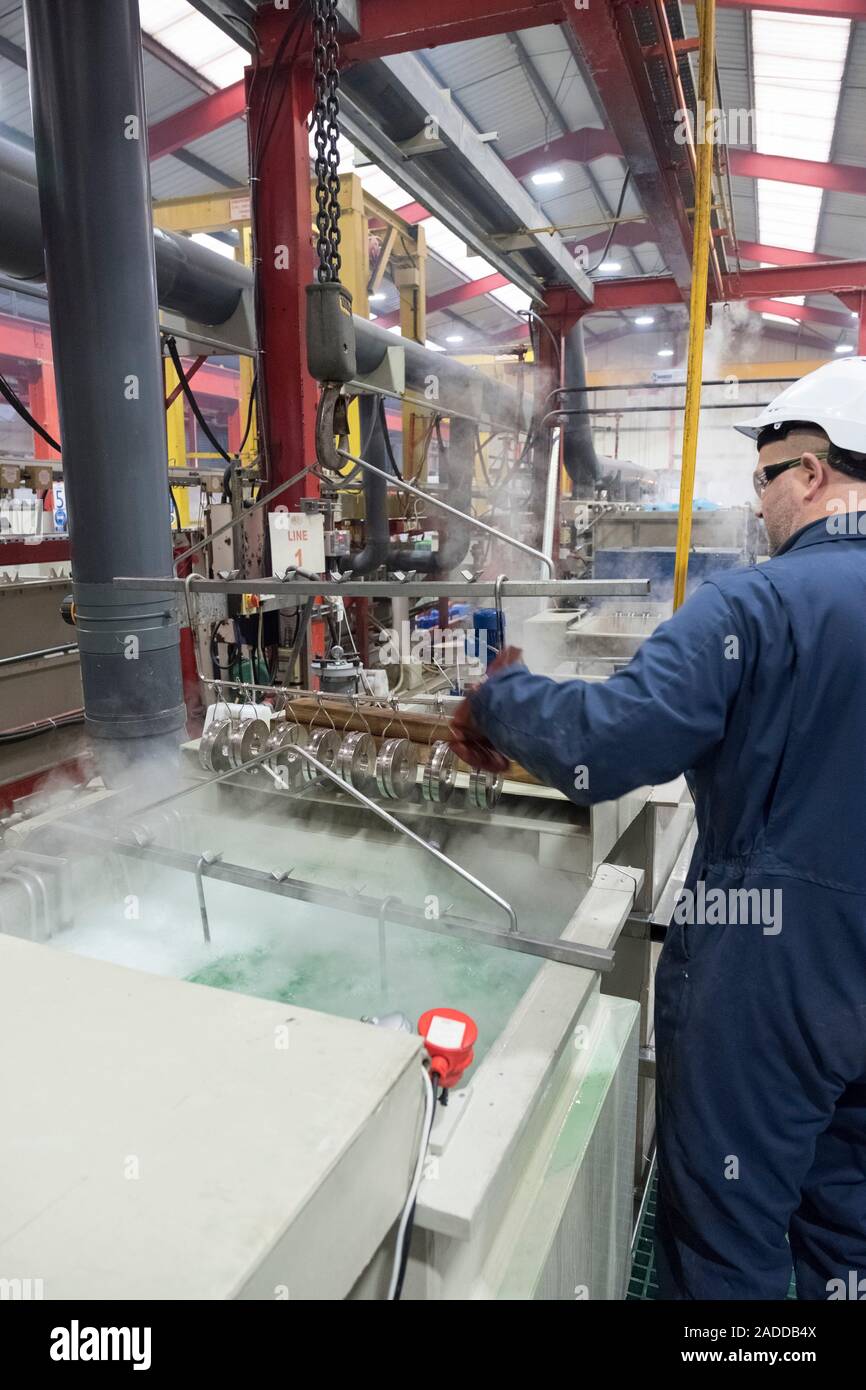 Electroless nickel plating factory. Chemical tanks and rinse tanks at a