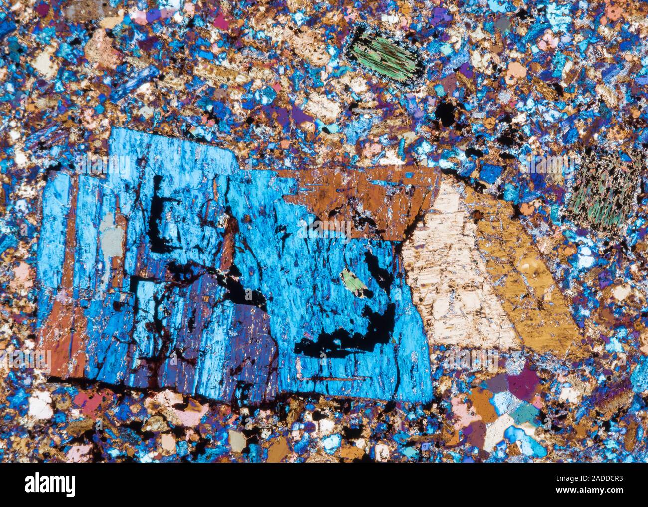 Rhyolite mineral rock crystals, polarised light micrograph. This rock ...