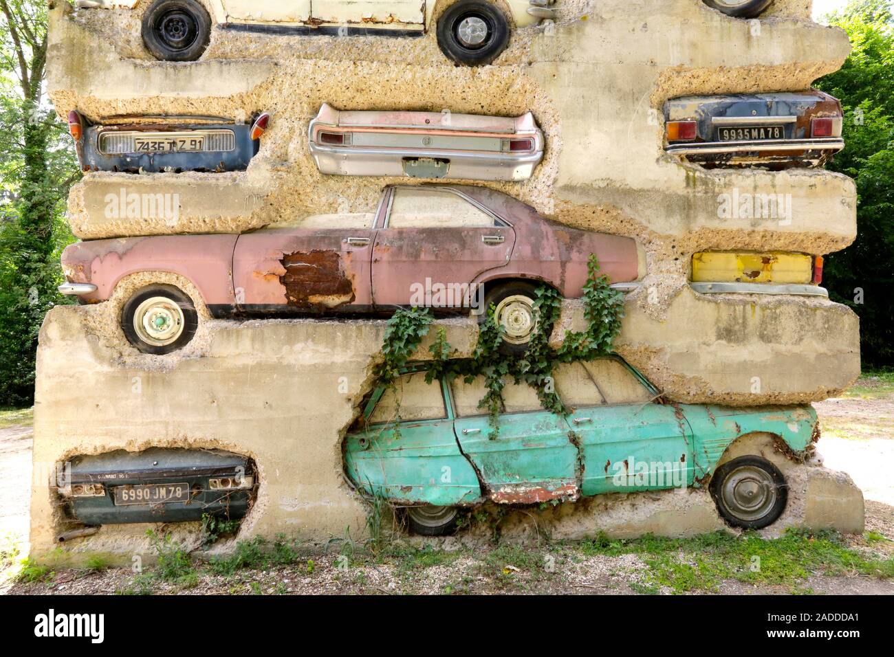 Long Term Parking sculpture, close-up. This artwork was completed in 1982.  It consists of 60 cars encased in concrete to form an 18-metre-high tower  Stock Photo - Alamy