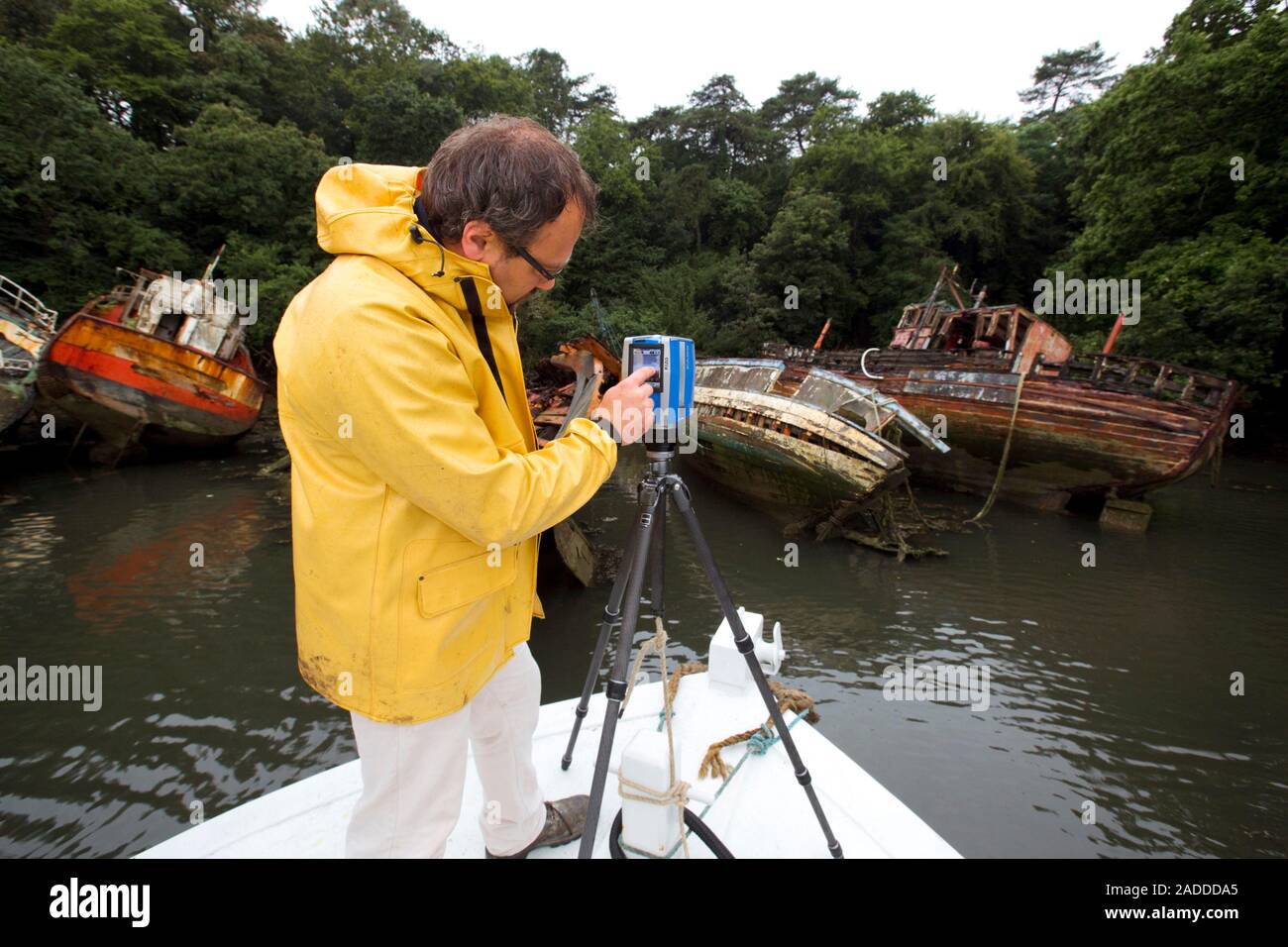 Laser Scanner Boat Boat graveyard laser scanning. Museum researcher recording the state of ...