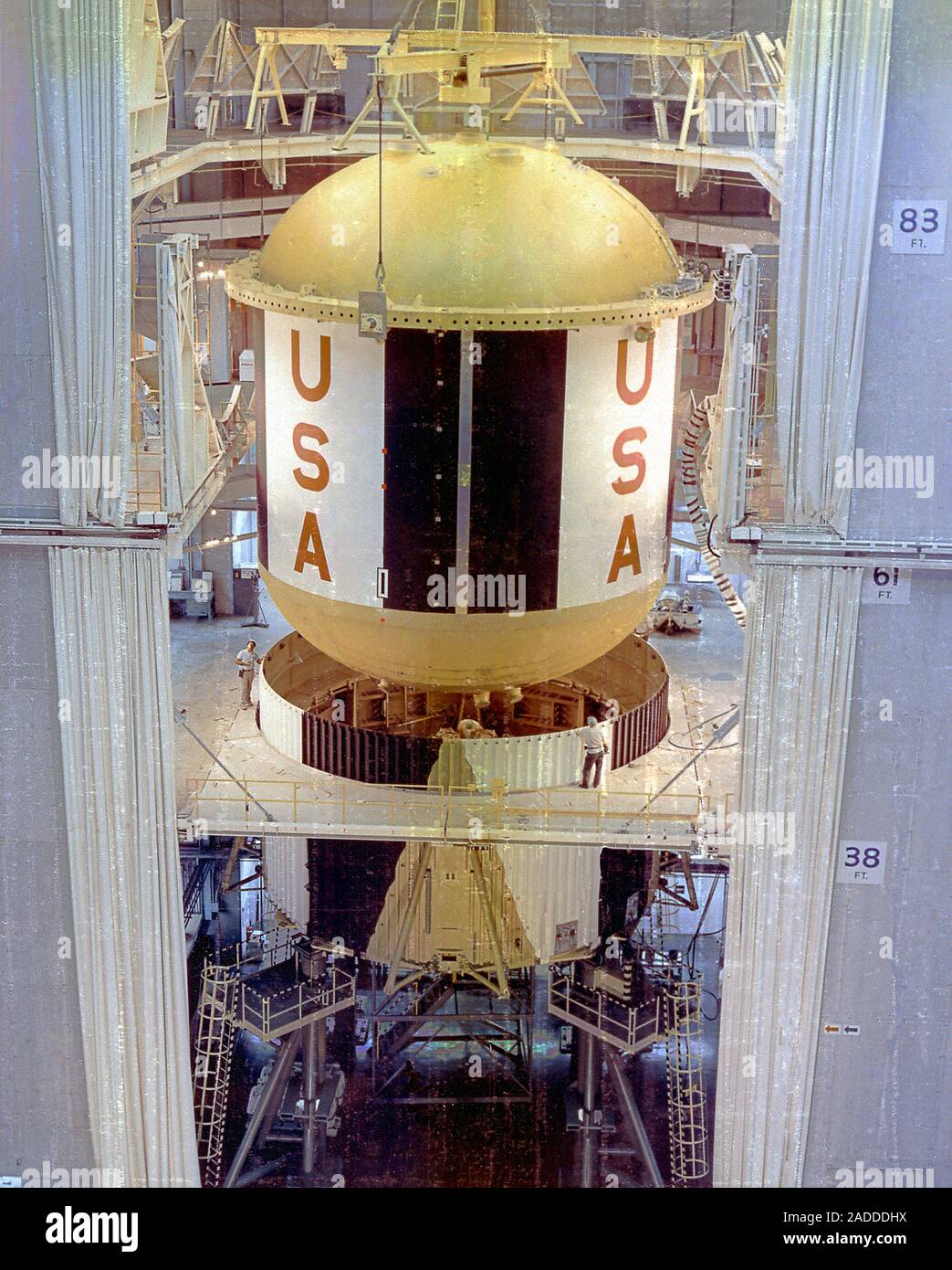 Saturn V first stage vertical assembly, 1967. Lowering of the fuel tank