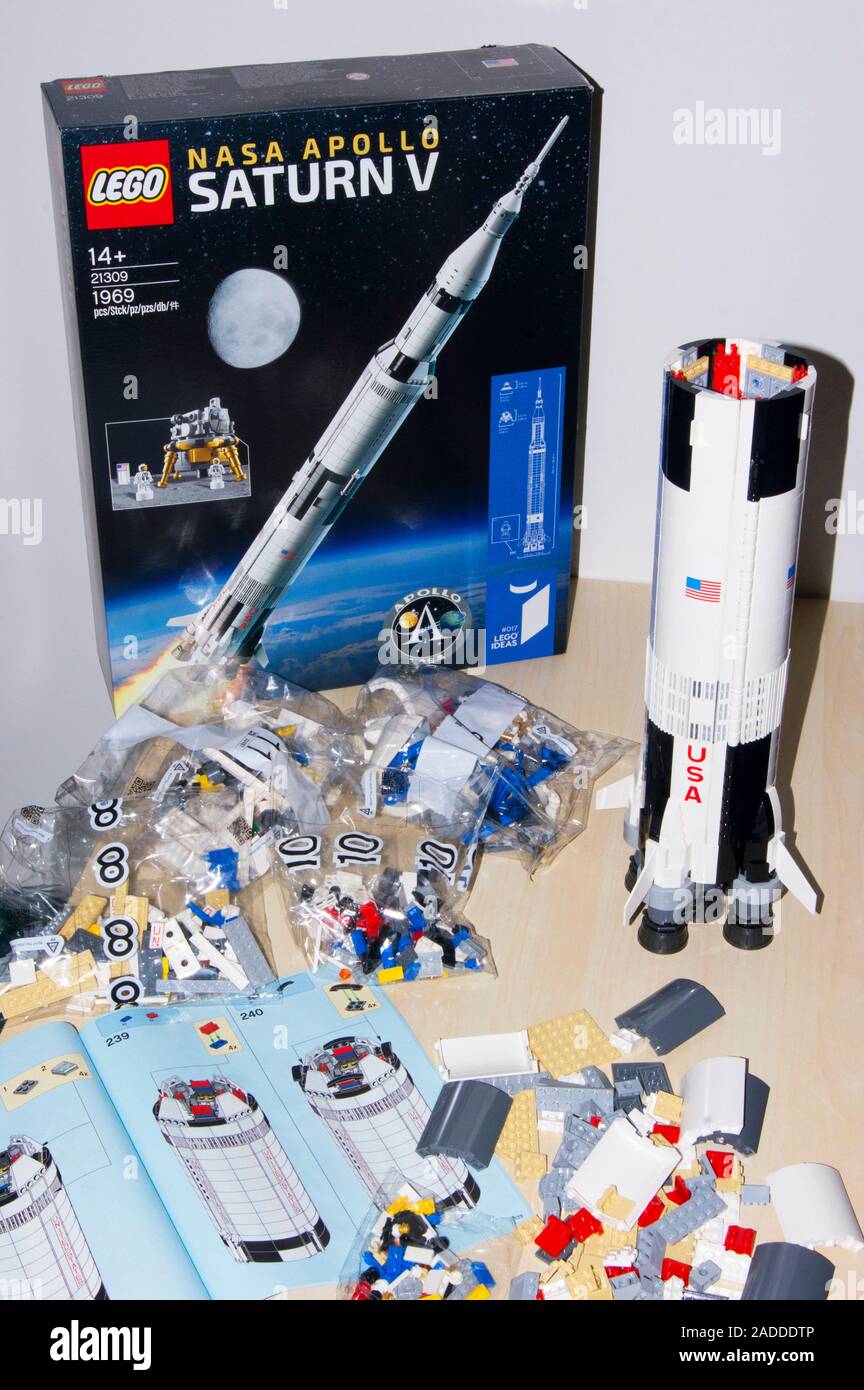 Lego NASA Apollo Saturn V construction kit showing the box instruction book completed first stage of the rocket and several bags of parts for the se Stock Photo Alamy