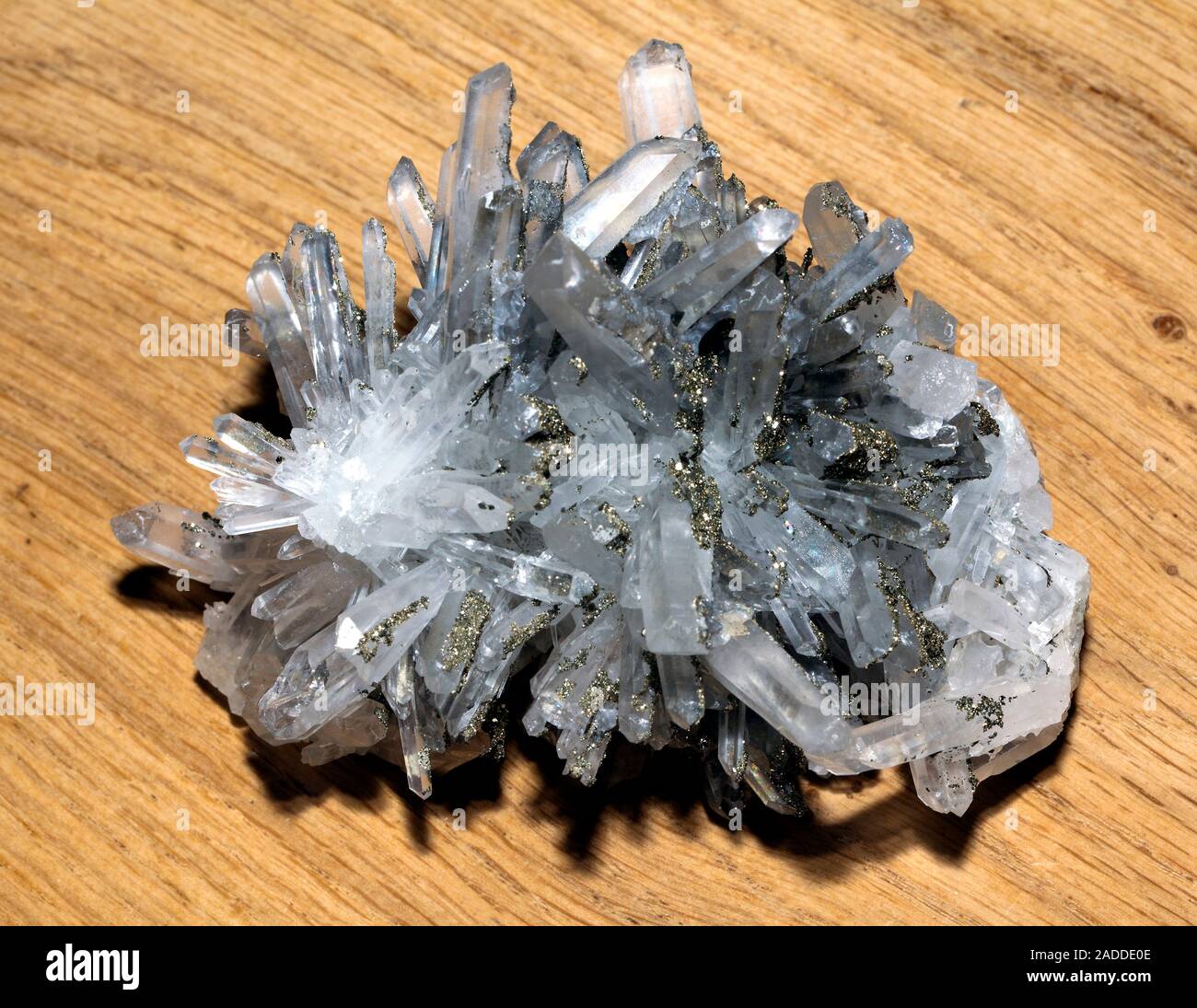 Sample of clear crystalline quartz, the substrate interspersed with small  crystals of pyrite that have a characteristic golden metallic lustre. The  qu Stock Photo - Alamy