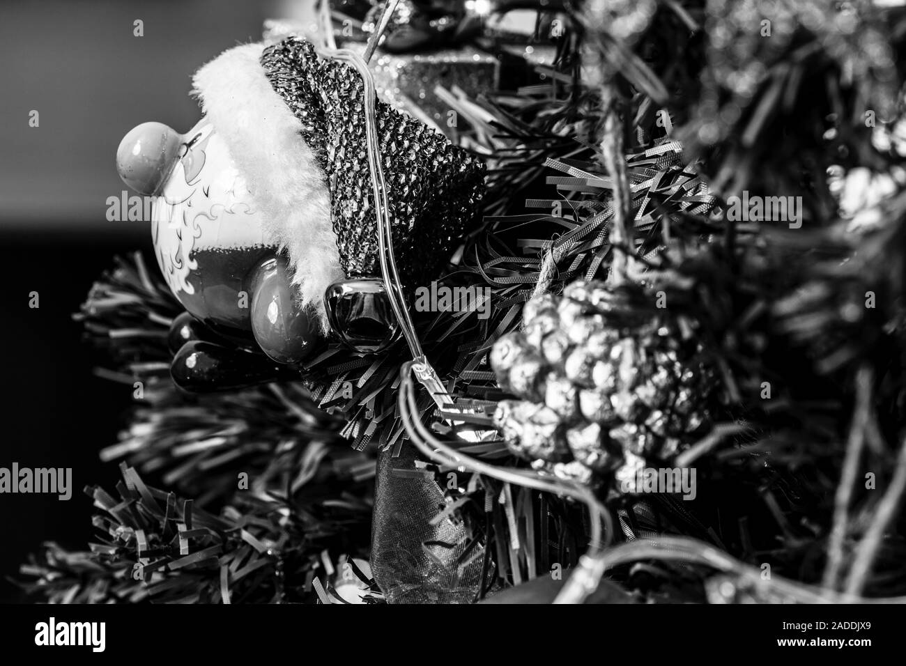 Christmas hanging decorations. Decorated Christmas tree. Fir branch with decorations. Black and white photo. Stock Photo